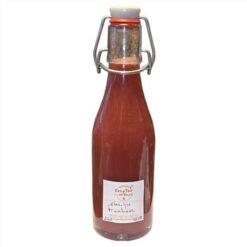 Vinaigre mangue présenté en bouteille, idéal pour assaisonner salades, crudités, poissons, volailles, marinades et recettes sucrées salées.